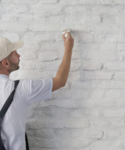 Man painting wall